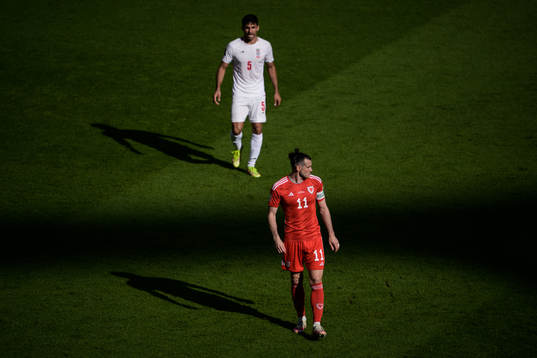 Milad Mohammadi of Iran and Gareth Bale of Wales