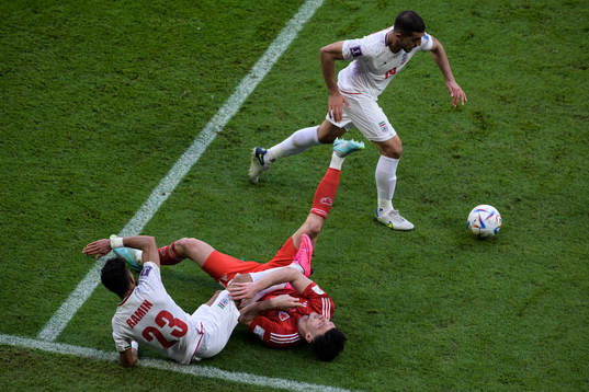 Ramin Rezaeian and Majid Hosseini of Iran in action against