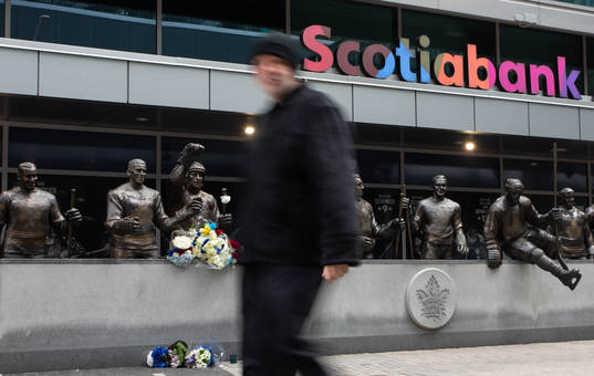 A passerby walks past at a statue of the late Börje