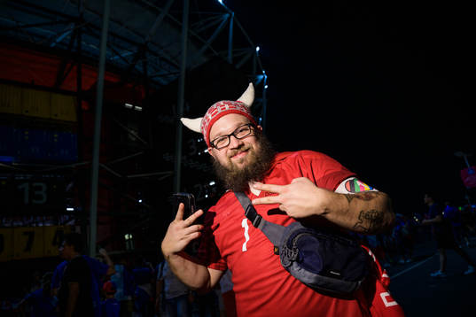 A Denmark fan poses with an One Love armband