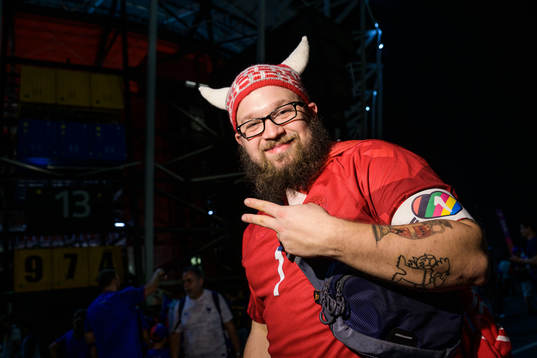 A Denmark fan poses with an One Love armband