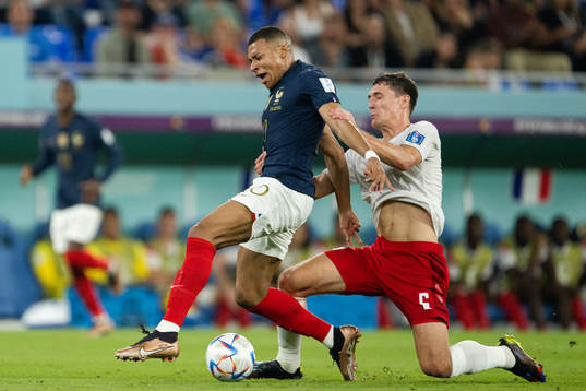 Kylian Mbappe of France and Andreas Christensen of Denmark