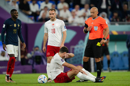 Andreas Christensen of Denmark receives a yellow card
