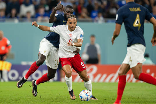 Remi Elie of France and Martin Braithwaite of Denmark