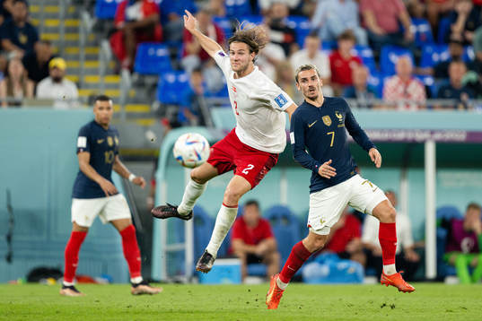 Joachim Andersen of Denmark and Antoine Griezmann of France