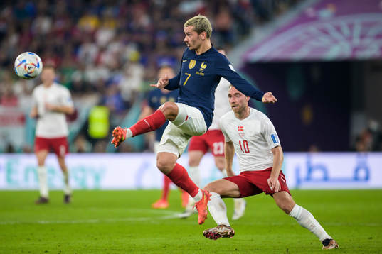 Antoine Griezmann of France and Christian Eriksen of Denmark