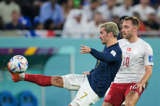 Antoine Griezmann of France and Christian Eriksen of Denmark