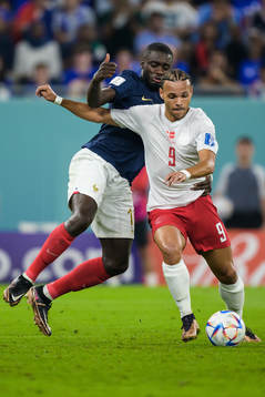 Dayot Upamecano of France and Martin Braithwaite of Denmark