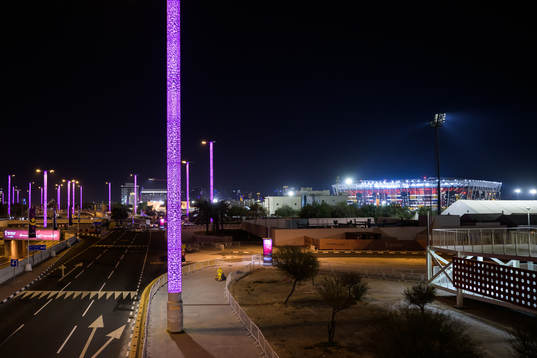 Stadium 974 is seen in the background as a migrant worker