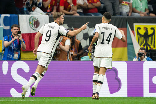 Niclas Füllkrug and Jamal Musiala of Germany celebrate the