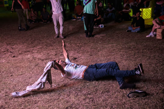 A man celebrates the 0-2 goal as he watches the match