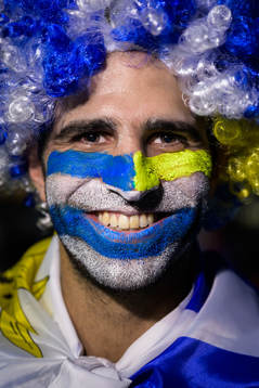 An Uruguay fan poses for a portrait