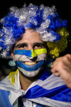 An Uruguay fan poses for a portrait