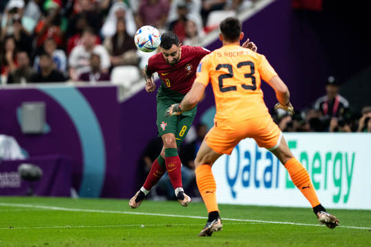Bruno Fernandes of Portugal and goalkeeper Sergio Rochet of