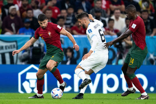 Ruben Dias and William Carvalho of Portugal and Rodrigo