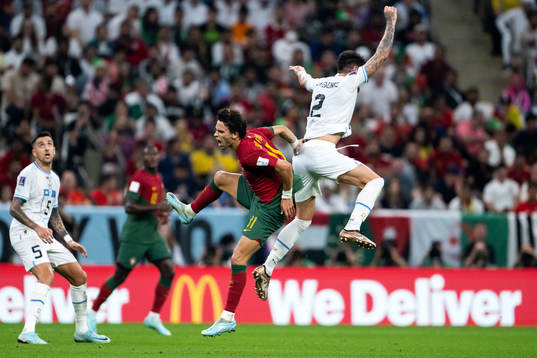 Joao Felix of Portugal and Jose Maria Gimenez of Uruguay
