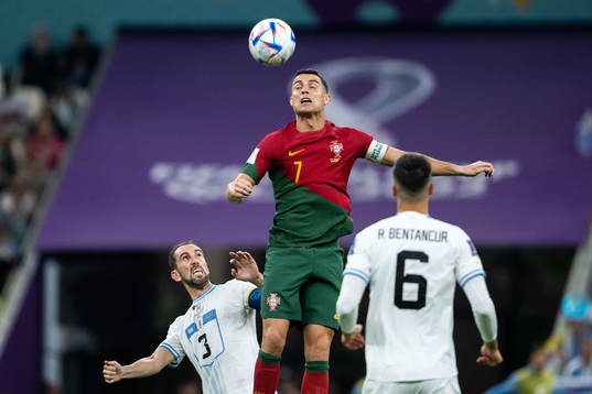 Diego Godin and Rodrigo Bentancur of Uruguay and Cristiano