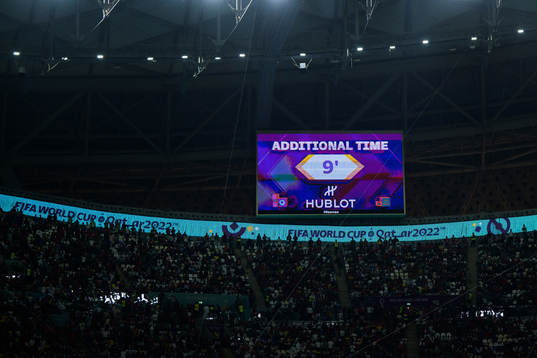 A screen announces nine minutes additional time added