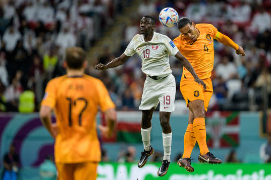 Almoez Ali of Qatar and Virgil van Dijk of Netherlands