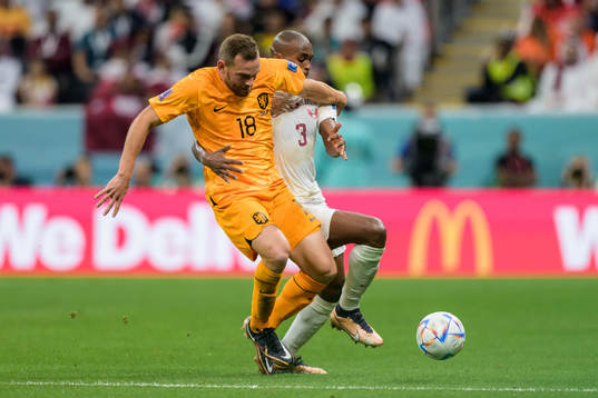 Vincent Janssen of Netherlands and Abdelkarim Hassan of