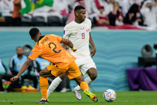Jurrien Timber of Netherlands and Mohammed Muntari of Qatar
