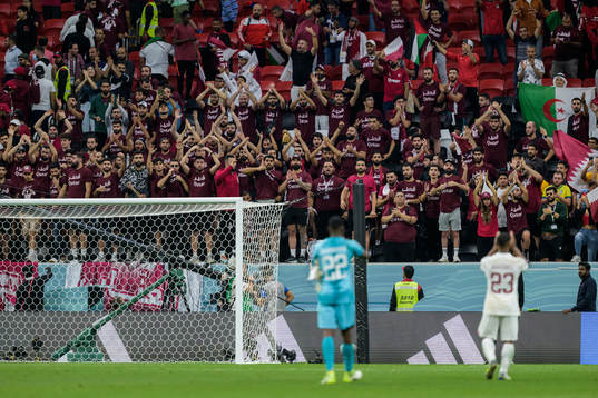 Supporters of Qatar together with goalkeeper Meshaal