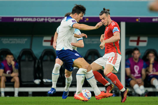 Harry Maguire of England and Gareth Bale of Wales