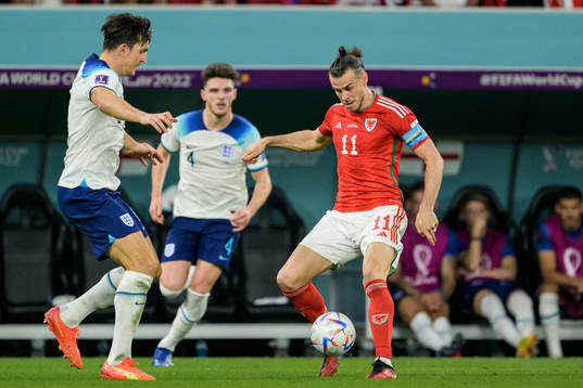 Harry Maguire of England and Gareth Bale of Wales