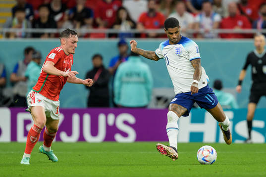 Connor Roberts of Wales and Marcus Rashford of England