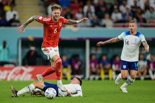 Joe Rodon of Wales and Phil Foden of England