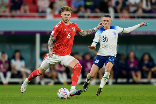Joe Rodon of Wales and Phil Foden of England