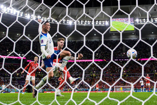 Phil Foden of England challenges Joe Rodon of Wales