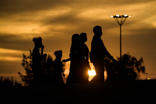 A family walks towards the arena