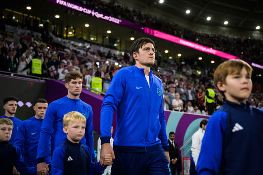 John Stones and Harry Maguire of England enter the pitch
