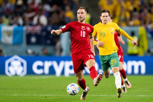 Christian Eriksen of Denmark and Craig Goodwin of Australia