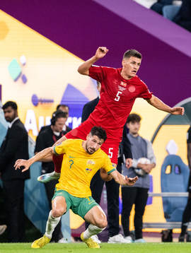 Joakim Mæhle of Denmark and Mathew Leckie of Australia