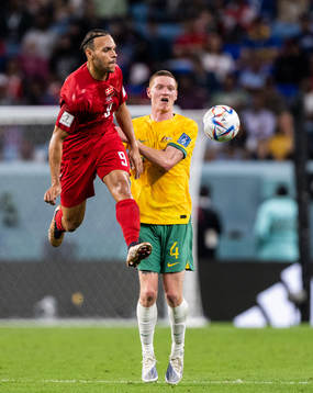 Martin Braithwaite of Denmark and Kye Rowles of Australia