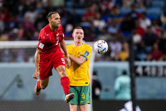 Martin Braithwaite of Denmark and Kye Rowles of Australia
