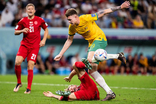 Kasper Dolberg of Denmark and Harry Souttar of Australia in