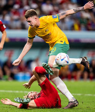 Kasper Dolberg of Denmark and Harry Souttar of Australia in