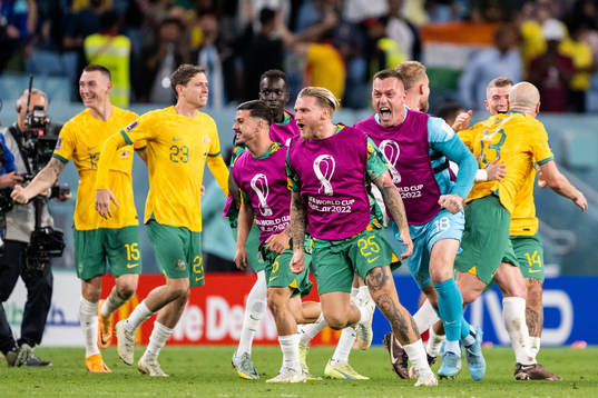 Jason Cummings and goalkeeper Danny Vukovic of Australia