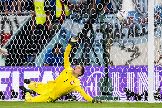 Goalkeeper Wojciech Szczesny of Poland saves a penalty