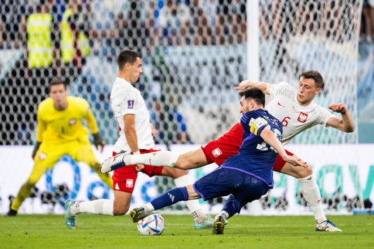 Lionel Messi of Argentina and Krystian Bielik of Poland