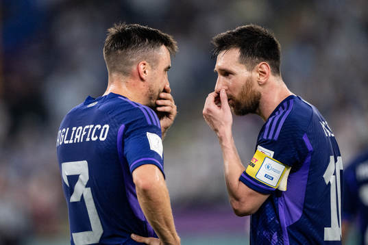 Nicolas Tagliafico and Lionel Messi of Argentina