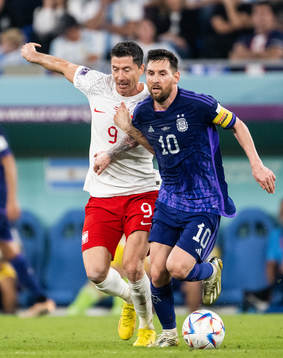 Robert Lewandowski of Poland and Lionel Messi of Argentina