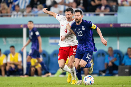 Robert Lewandowski of Poland and Lionel Messi of Argentina