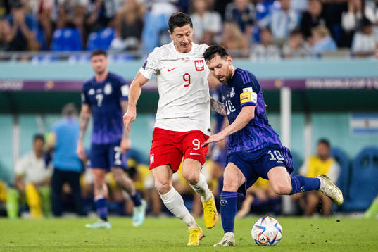 Robert Lewandowski of Poland and Lionel Messi of Argentina