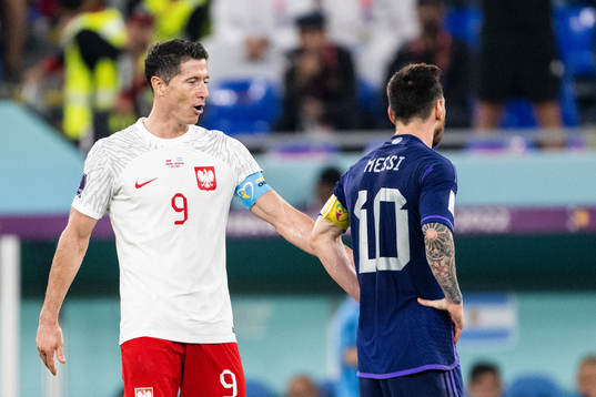 Robert Lewandowski of Poland and Lionel Messi of Argentina