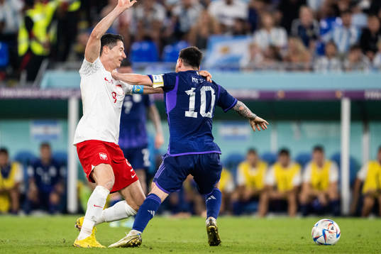 Robert Lewandowski of Poland and Lionel Messi of Argentina