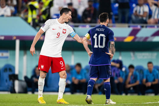 Robert Lewandowski of Poland and Lionel Messi of Argentina
